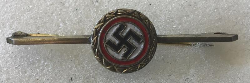 PARTY BADGE TIEPIN OR BROOCH.