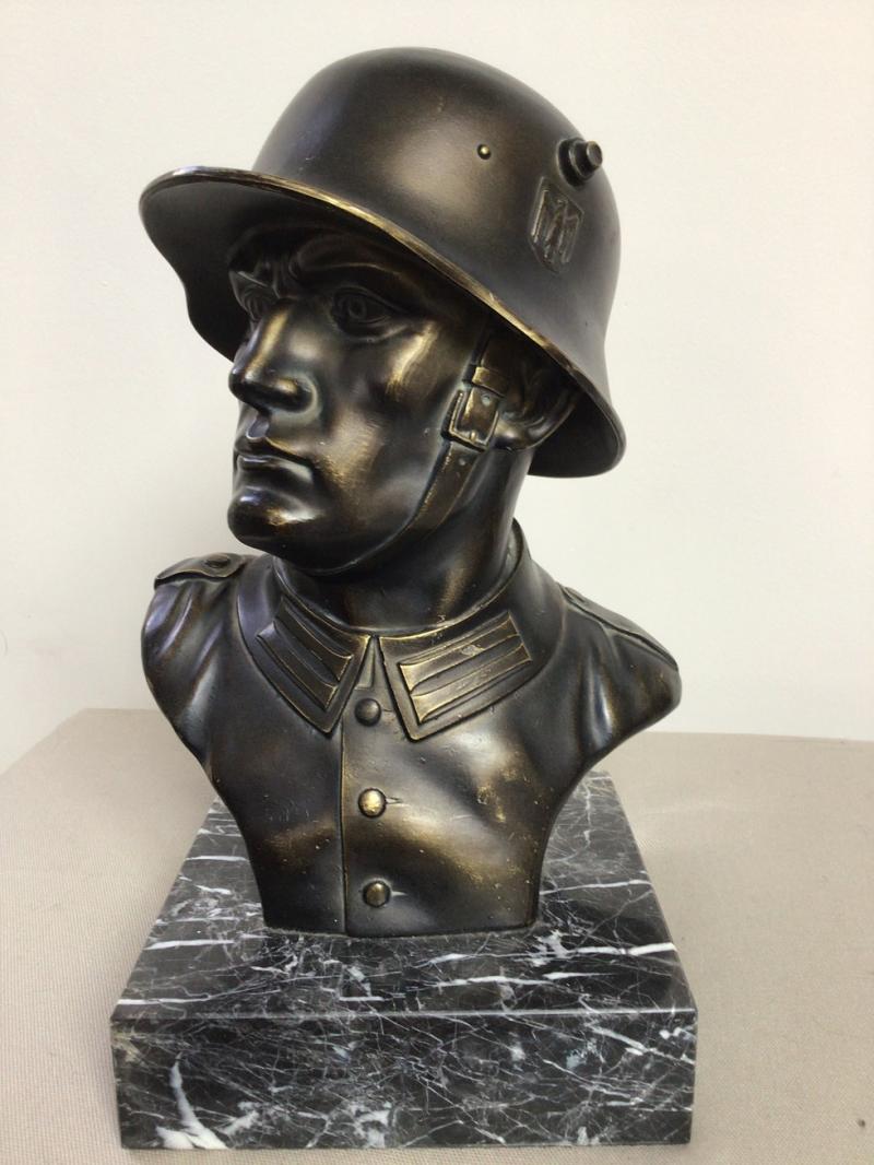 BRONZE BUST OF A W/H SOLDIER IN HELMET.