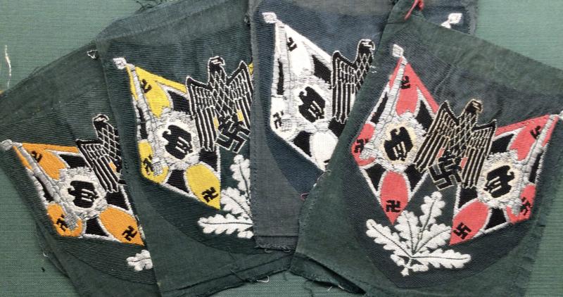FOUR UNISSUED WEHRMACHT STANDARD BEARERS ARMBADGES.